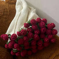 Red rose bouquet blanket on a sofa