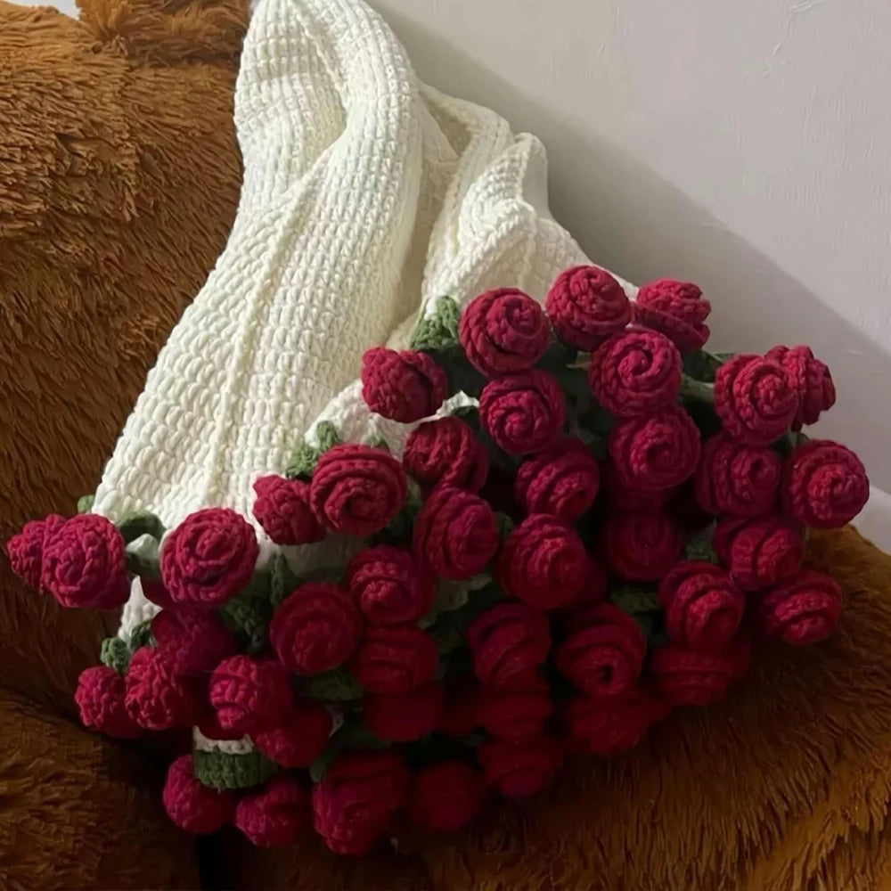 Red rose bouquet blanket on a sofa